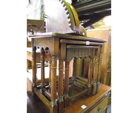 A nest of three graduated oak occasional tables on turned supports, together with a Victorian mahogany hanging corner shelf w