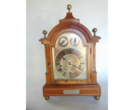 An Edwardian walnut veneered bracket clock, with broken arch silvered dial, regulator and chime/silent selector with three tr