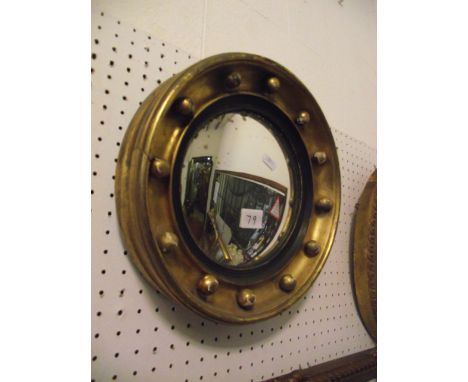 A small 19th century gilt framed convex wall mirror with ebonised reeded slip and ball surround, 30 cm diameter approx, toget