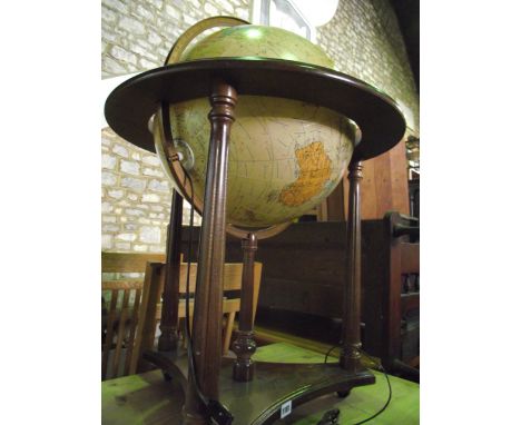 A 16 inch diameter heirloom globe by Replogle Le Roy M. Tolman, Cartographer raised on a traditional framework with illuminat