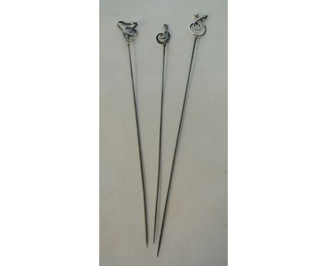 A collection of three silver hatpins, Charles Horner, 1908 - 1910, each with scrolling terminal, pin 20.2cm to 22.2cm in leng