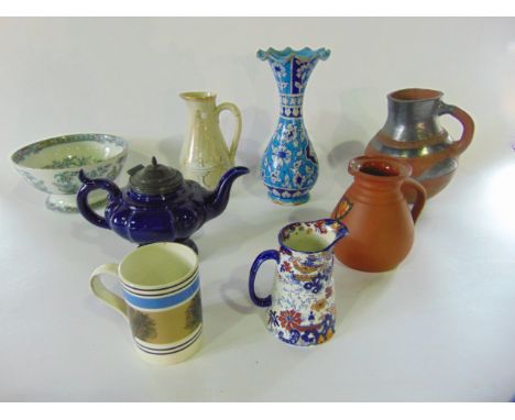 A collection of 19th century and other ceramics including an unusual earthenware type jug with rounded base, simple incised d