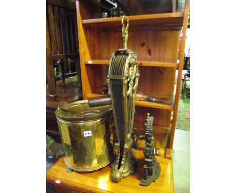 A cast brass folding crescent fireguard with pierced panels, cast iron fire ornaments, Punch and Judy, bellows etc.