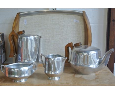 A Picquot tea set comprising teapot, hot water pot, two handled sugar basin, milk jug and associated tray