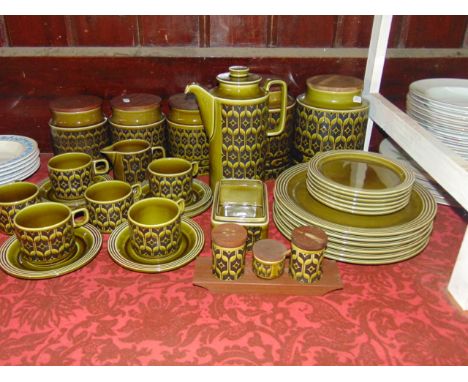 A quantity of Hornsea Heirloom wares with olive green glaze comprising a pair of large storage jars inscribed Biscuits and Fl