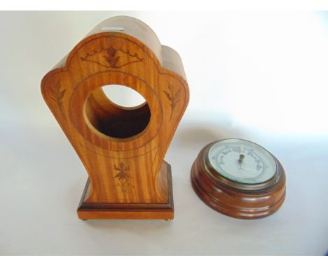 An Art Nouveau balloon shaped clock, case with geometric marquetry inlay, together with an Edwardian aneroid barometer, in a 
