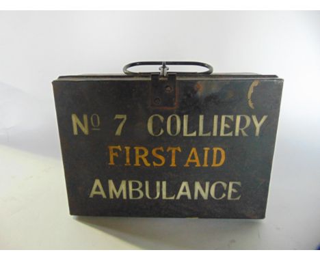 A 20th century tin cased first aid kit containing various boxed and packaged wound dressings, etc, with painted text to exter