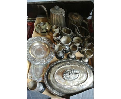 A mixed selection of silver plated wares to include antique tea wares, miniature trophy cups, an oval tureen with presentatio