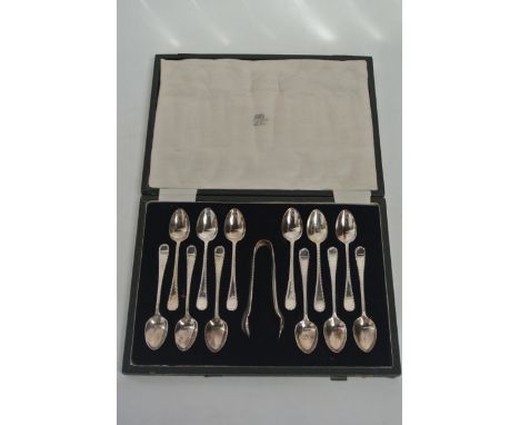 A cased set of twelve Victorian silver plated teaspoons and sugar tongs together with a Malacca walking cane with white metal