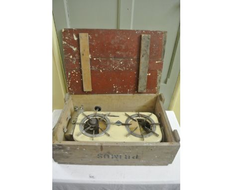 A vintage Primus Radius two ring stove with cream enamelled rectangular plate, housed within its original packing crate with 