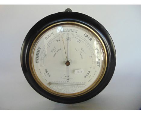 An Edwardian aneroid barometer, with printed dial incorporating a horizontal thermometer, with Fahrenheit and centigrade gaug