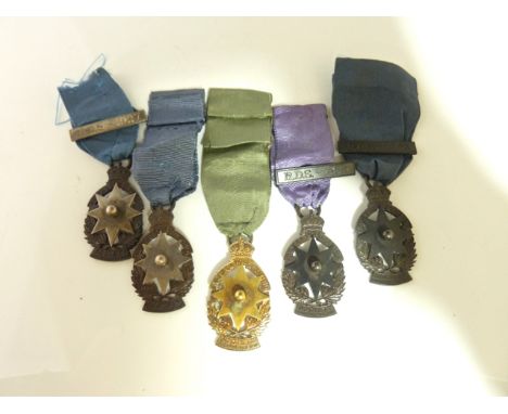 A 15ct gold medal, The Royal Drawing Society Incorporated, for C.J.E Coombs 1928; and four further matching medals, in silver