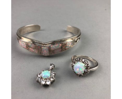 CONTEMPORARY SILVER BANGLE, set with opal, along with a silver pendant, set with opal and a dress ring (3)