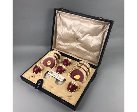 ROYAL WORCESTER PART COFFEE SERVICE, comprising four cups and six saucers, decorated in red and gilt, in a fitted case
