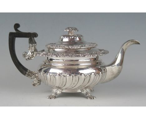 A George IV silver teapot, maker Waterhouse &amp; Ryland, Birmingham, 1824, monogrammed, with moulded floral decorated border