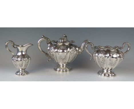 A matched Victorian silver three-piece pedestal teaset, makers A G Whighton, Edinburgh 1838 and Leonard Urquhart, Edinburgh, 