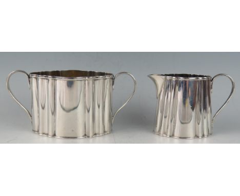 A Victorian part tea service, maker Hukin &amp; Heath, London, 1888, of oval lobed form, includes cream jug and sugar basin, 