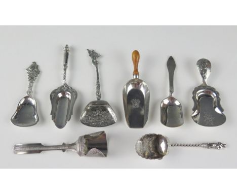 A collection of four continental silver caddy shovels, together with four English silver caddy shovels, various makers and da