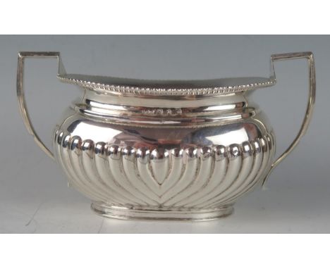 A Victorian silver barge-shaped twin handled sugar basin, maker MM , Birmingham, 1894, with beaded rim and half reeded decora