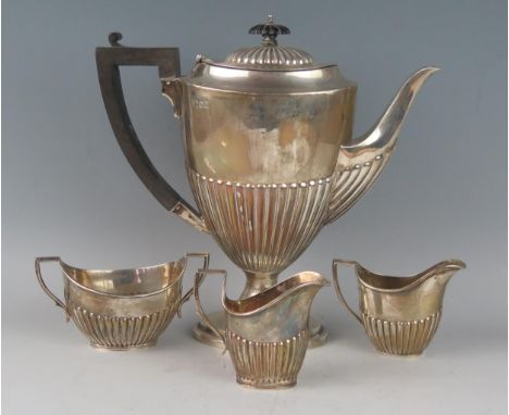 An Edward VII silver pedestal teapot, maker Martin, Hall &amp; Co, London, 1906, of oval tapering form with half reeded decor