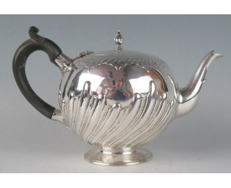 A Victorian silver teapot, maker Charles Stuart Harris, London, 1886, of globular circular for, with writhen decoration, rais