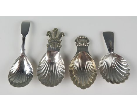 Four assorted silver caddy spoons, various makers and dates, each with shell shaped bowls, total weight of silver 81gms, 2.61