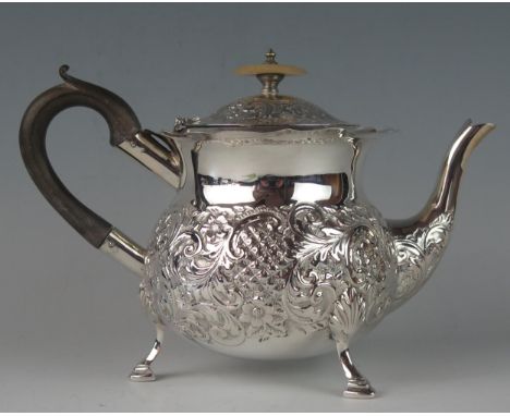 An Edward VII silver teapot, maker C.H possibly Charles Horner, Birmingham, 1906, of circular ovoid form with embossed foliat