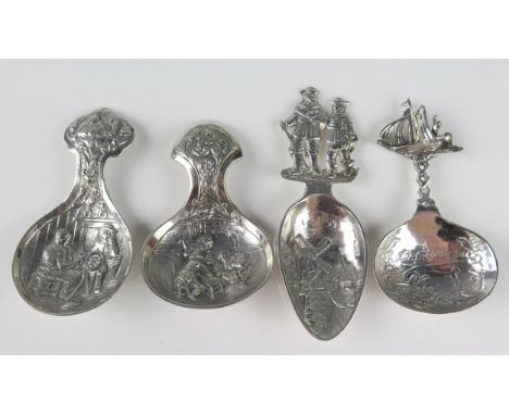 Four Dutch silver caddy spoons, with embossed figural decoration, of traditional design total weight of silver 69gms, 2.22ozs