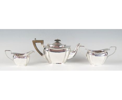 A George V silver three-piece bachelors tea service, maker Williams (Birmingham) Ltd, Birmingham, 1910, of rectangular outlin