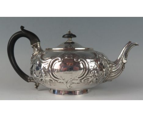 A George III silver teapot, maker Robert Garrard I, London, 1812, crested, of squat circular form, with shallow domed hinged 