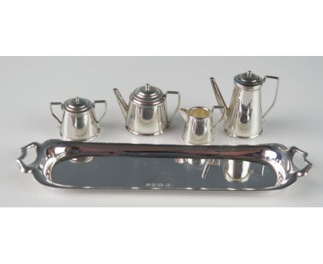 A matched silver miniature four-piece tea and coffee service, various makers and dates, includes teapot, coffee pot, cream ju