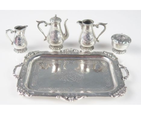 A matched Dutch and continental miniature silver coffee service, stamp marks, includes coffee pot, sugar basin and cover, cre