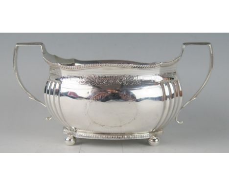 A George III silver twin-handled sugar basin, maker Charles Fox I, London, 1807, of barge-shaped outline, with fluted corners
