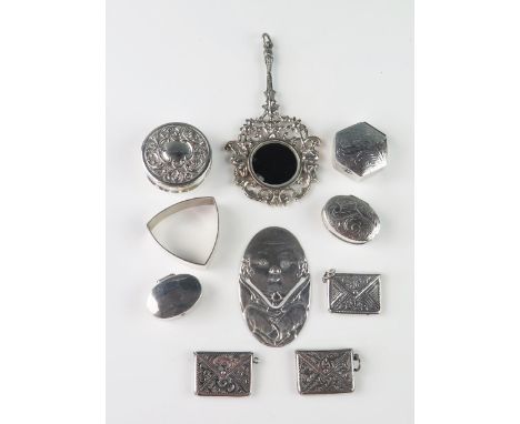 A assortment of silver collectables, various makers and dates, includes a hand mirror, book marker, stamp holders, patch boxe