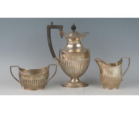 A matched part three-piece tea service, maker Mappin &amp; Webb, Sheffield, 1913/1919, includes hot water jug, cream jug and 