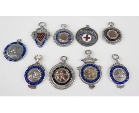 A collection of nine silver and enamel medallions/fobs, various makers and dates, including billiards, running, football, etc
