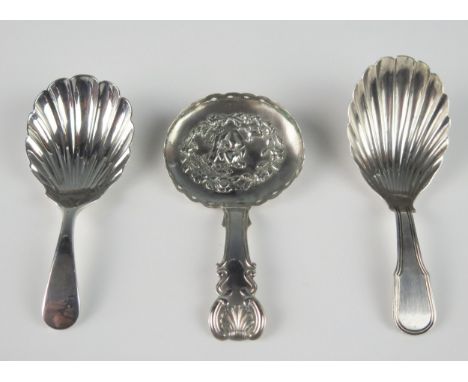 A George III silver caddy spoon, maker John Bettridge, Birmingham, 1817, together with two other caddy spoons with shell-shap