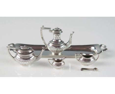 A miniature silver four-piece tea and coffee service, maker M K (J) Ltd, Birmingham, 1969, includes, teapot, coffee pot, suga