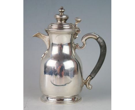 An Edward VII silver bachelors coffee pot, maker Haseler Brothers, London, 1907, crested and monogrammed, of ovoid form with 