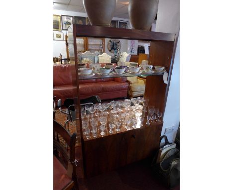 A mid 20th Century rosewood display unit/room divider with glass top and shelf above two cupboard doors. H-153cm, W-91cm, D-4