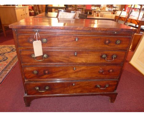 A Georgian mahogany chest of four drawer, raised on carved bracket feet.