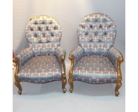 A pair of spoon back armchairs with Art Nouveau style button back upholstered raised on cabriole legs