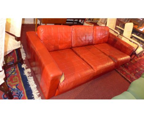 A Gimson and Slater red leather three seater sofa