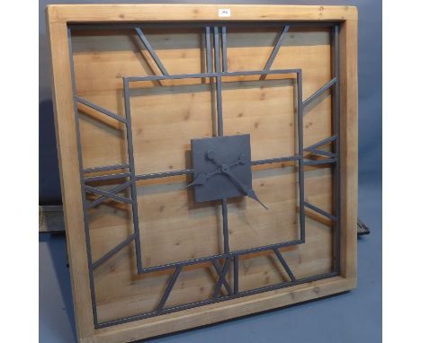 A large contemporary wall  clock. 