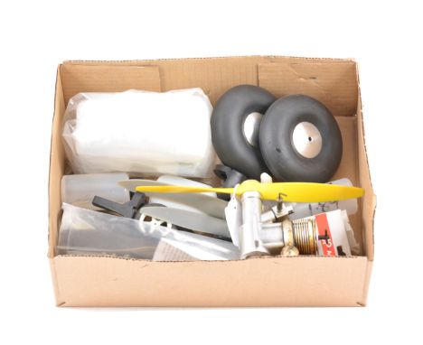 Box containing 11 assorted props, Wheels, Fuel tanks and engine mounts, and PAW 35 R/C diesel.