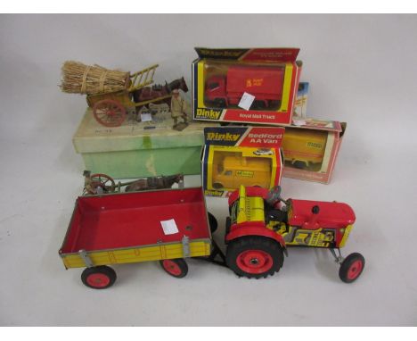 Mid 20th Century tin plate clockwork toy tractor with trailer, a Britains Home Farm Series tumbril in original box and a smal