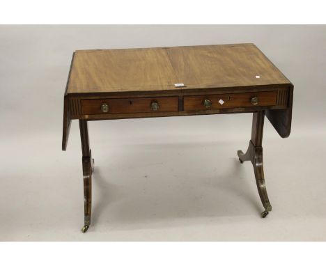 Regency mahogany and inlaid drop-leaf sofa table with two frieze drawers raised on rectangular cut and line inlaid supports a