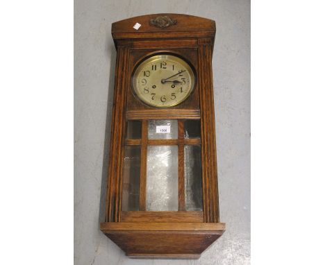 20th Century oak cased Vienna style wall clock having circular silvered dial with Arabic numerals and two train movement stri