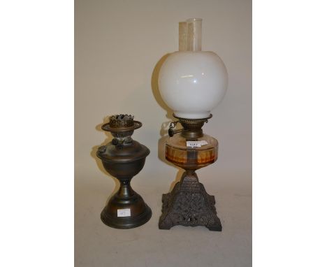 19th Century cast iron oil lamp with glass well, opaque glass shade and chimney and another oil lamp 