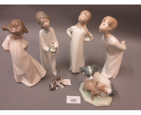 Group of four Lladro figures, one of a cat and two Nao figures 